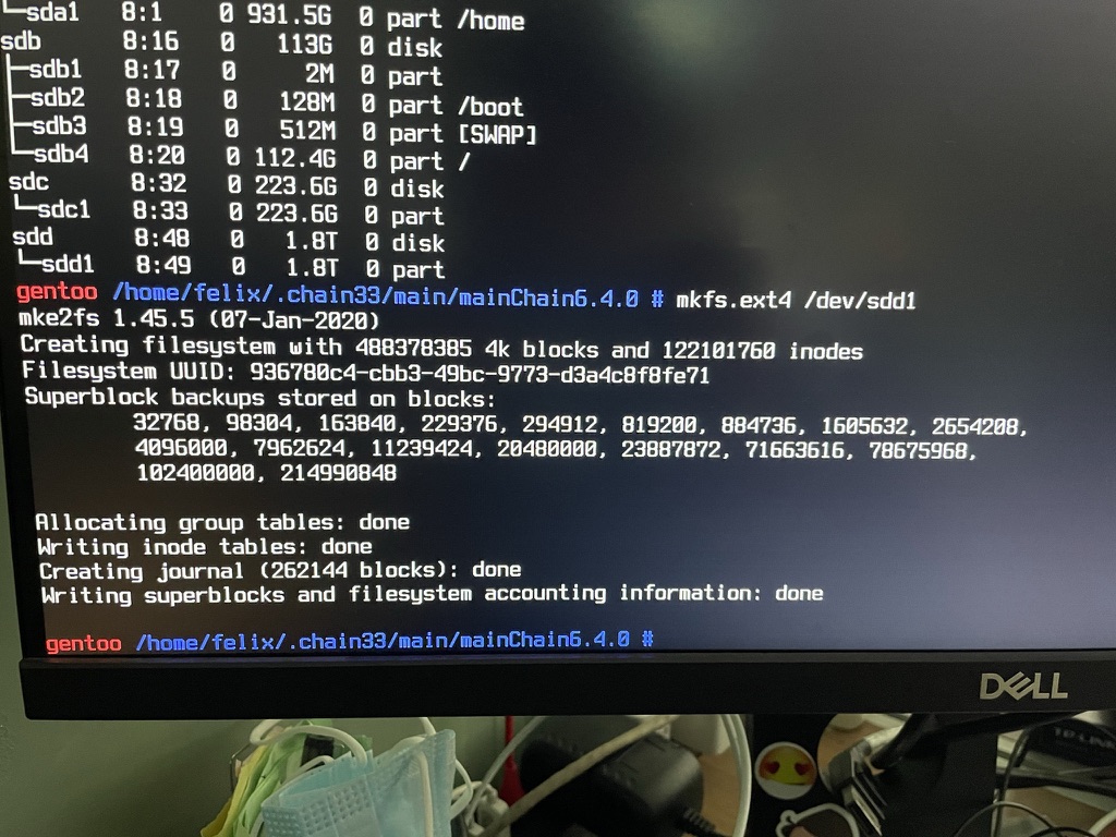 A terminal in a Gentoo environment formatting a new ext4 filesystem.